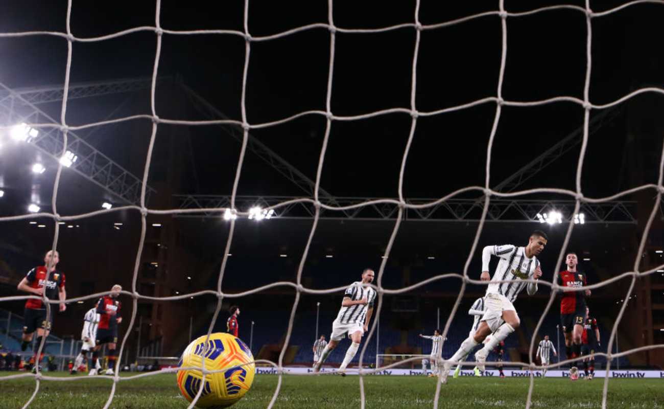 A View From Behind The Goal Net of Cristiano Ronaldo Turning Away to Celebrate After Scoring a Goal - Photo by Jonathan Moscrop/Getty Images