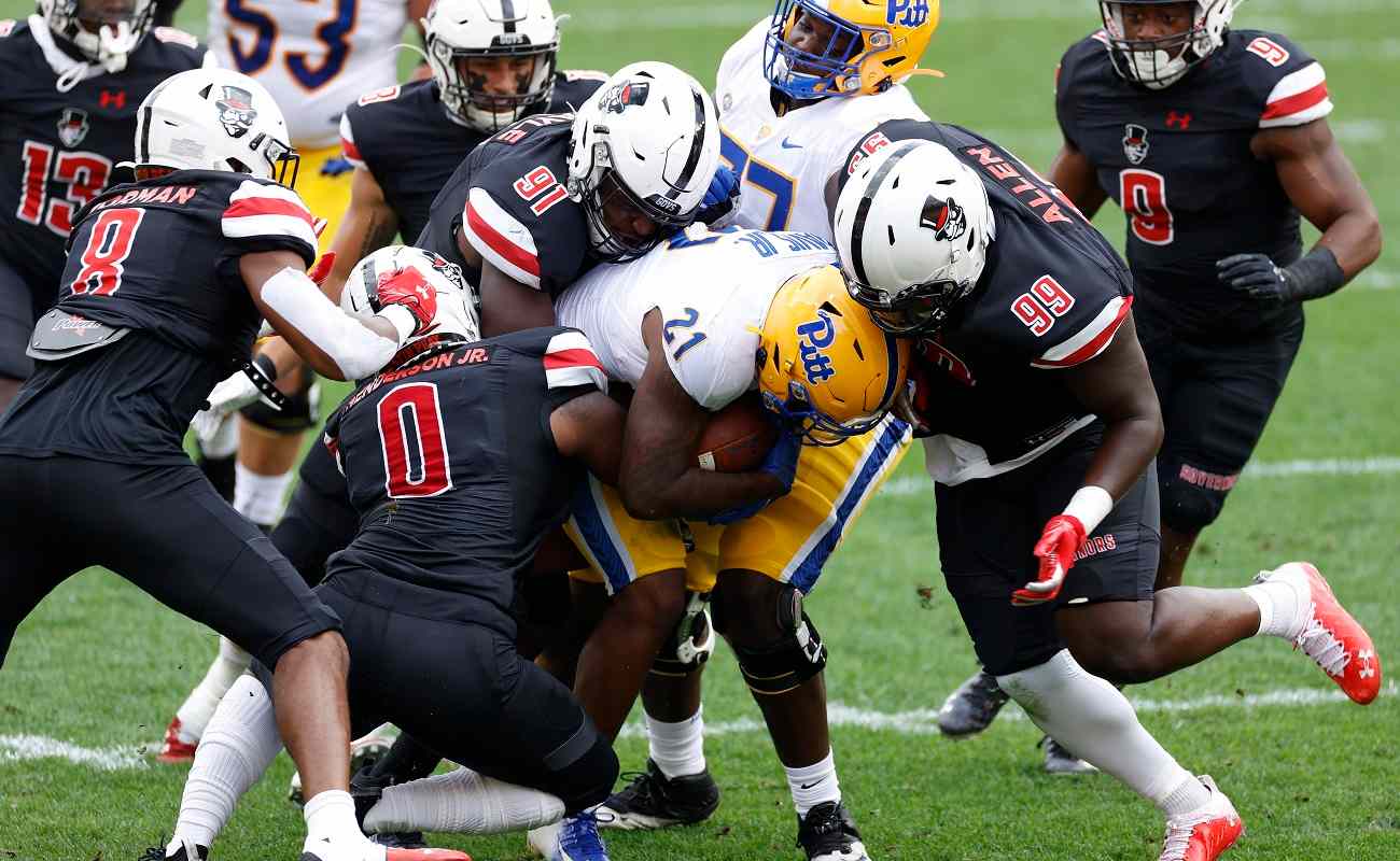 PITTSBURGH, PA - SEPTEMBER 12: Austin Peay Governors defenders combine to make a tackle during a game against the Pittsburgh Panthers at Heinz Field on September 12, 2020 in Pittsburgh, Pennsylvania. The Panthers won 55-0. (Photo by Joe Robbins/Getty Images)