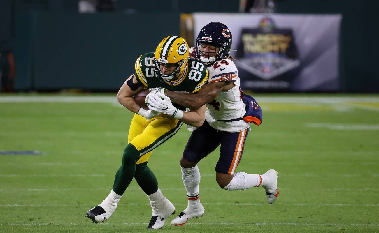 GREEN BAY, WISCONSIN - NOVEMBER 29: Robert Tonyan #85 of the Green Bay Packers runs with the ball while being tackled by Buster Skrine #24 of the Chicago Bears in the first quarter at Lambeau Field on November 29, 2020 in Green Bay, Wisconsin. (Photo by Dylan Buell/Getty Images)