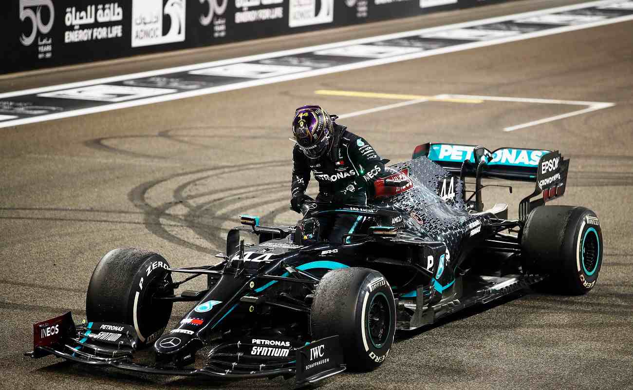 ABU DHABI, UNITED ARAB EMIRATES - DECEMBER 13: Third placed Lewis Hamilton of Great Britain and Mercedes GP climbs from his car after the F1 Grand Prix of Abu Dhabi at Yas Marina Circuit on December 13, 2020 in Abu Dhabi, United Arab Emirates. (Photo by Hamad I Mohammed - Pool/Getty Images)