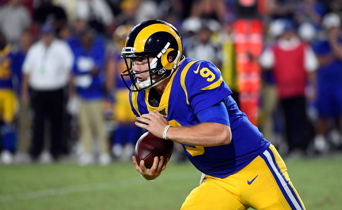 LOS ANGELES, CA - AUGUST 24: Quarterback John Wolford #9 of the Los Angeles Rams rushes against Denver Broncos during the second half of their pre season football game at Los Angeles Memorial Coliseum on August 24, 2019 in Los Angeles, California. (Photo by Kevork Djansezian/Getty Images)