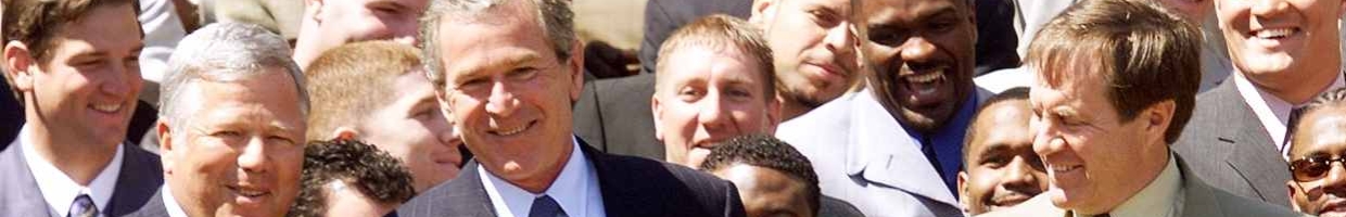 US President George W. Bush participates in a photo opportunity 02 April, 2002 with the 2002 National Football League Super Bowl Champion New England Patriots in the Rose Garden of The White House in Washington, DC. (LUKE FRAZZA/AFP via Getty Images)