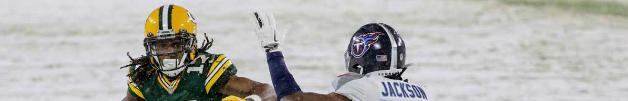 Davante Adams #17 of the Green Bay Packers runs with the ball while being chased by Adoree' Jackson #25 of the Tennessee Titans in the first quarter at Lambeau Field on December 27, 2020 in Green Bay, Wisconsin. (Photo by Dylan Buell/Getty Images)