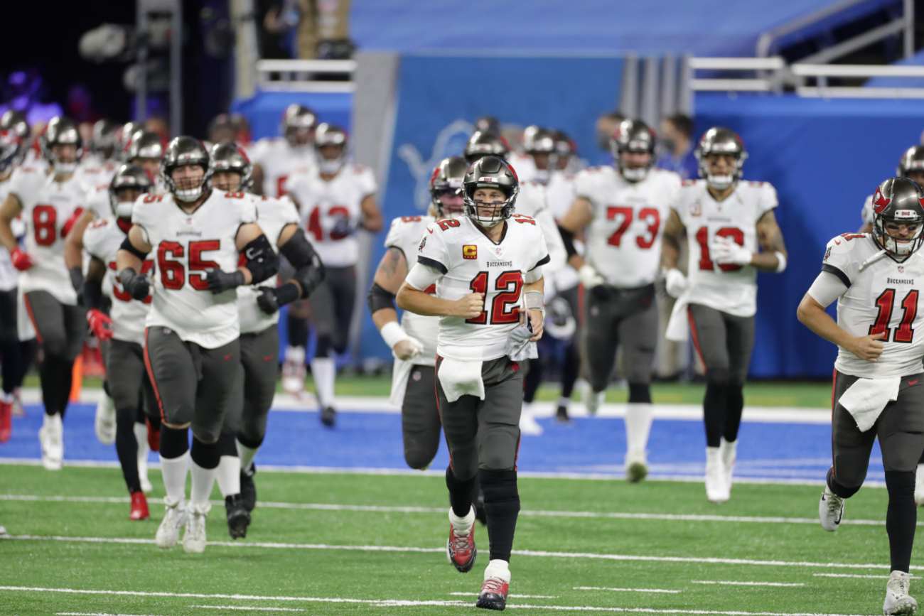 Tom Brady #12 of the Tampa Bay Buccaneers leads his team onto the field prior to the start of the game against the Detroit Lions at Ford Field on December 26, 2020 in Detroit, Michigan. Tampa defeated Detroit 47-7 (Photo by Leon Halip/Getty Images)