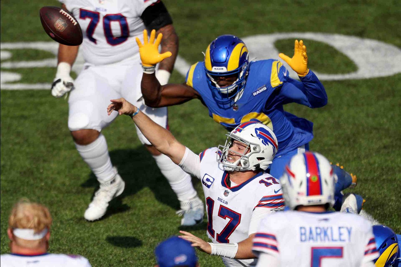 ALT: ORCHARD PARK, NEW YORK - SEPTEMBER 27: Josh Allen #17 of the Buffalo Bills is tackled while throwing the ball during the fourth quarter against the Los Angeles Rams at Bills Stadium on September 27, 2020 in Orchard Park, New York. (Photo by Bryan M. Bennett/Getty Images)