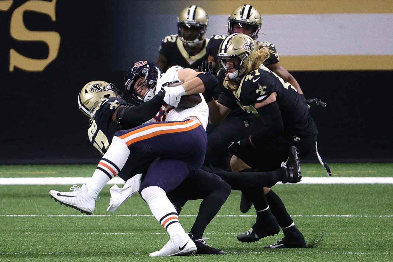 Cole Kmet #85 of the Chicago Bears is tackled by Malcolm Jenkins #27 of the New Orleans Saints during the second quarter in the NFC Wild Card Playoff game at Mercedes Benz Superdome on January 10, 2021 in New Orleans, Louisiana. (Photo by Chris Graythen/Getty Images)