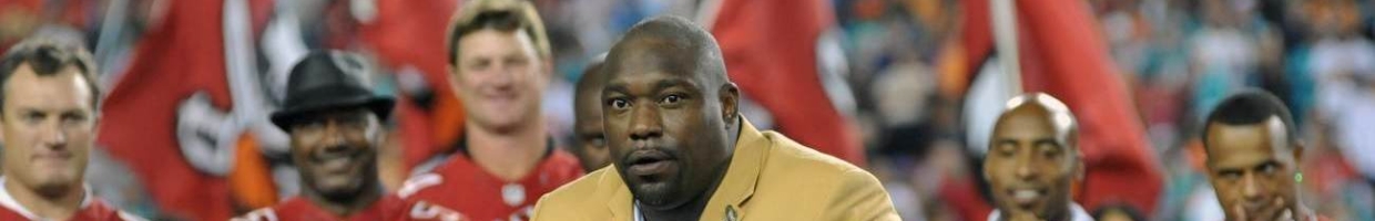 TAMPA, FL - NOVEMBER 11: NFL television commentator Warren Sapp receives his NFL Hall of Fame ring during halftime ceremonies as the Tampa Bay Buccaneers play against the Miami Dolphins November 11, 2013 at Raymond James Stadium in Tampa, Florida. Tampa won 22 - 19. (Photo by Al Messerschmidt/Getty Images)