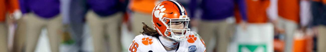 CHARLOTTE, NORTH CAROLINA - DECEMBER 19: Quarterback Trevor Lawrence #16 of the Clemson Tigers runs with the ball in the fourth quarter against the Notre Dame Fighting Irish during the ACC Championship game at Bank of America Stadium on December 19, 2020 in Charlotte, North Carolina. (Photo by Jared C. Tilton/Getty Images)