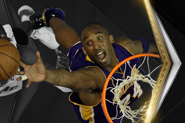 Kobe Bryant jumps to the basketball net