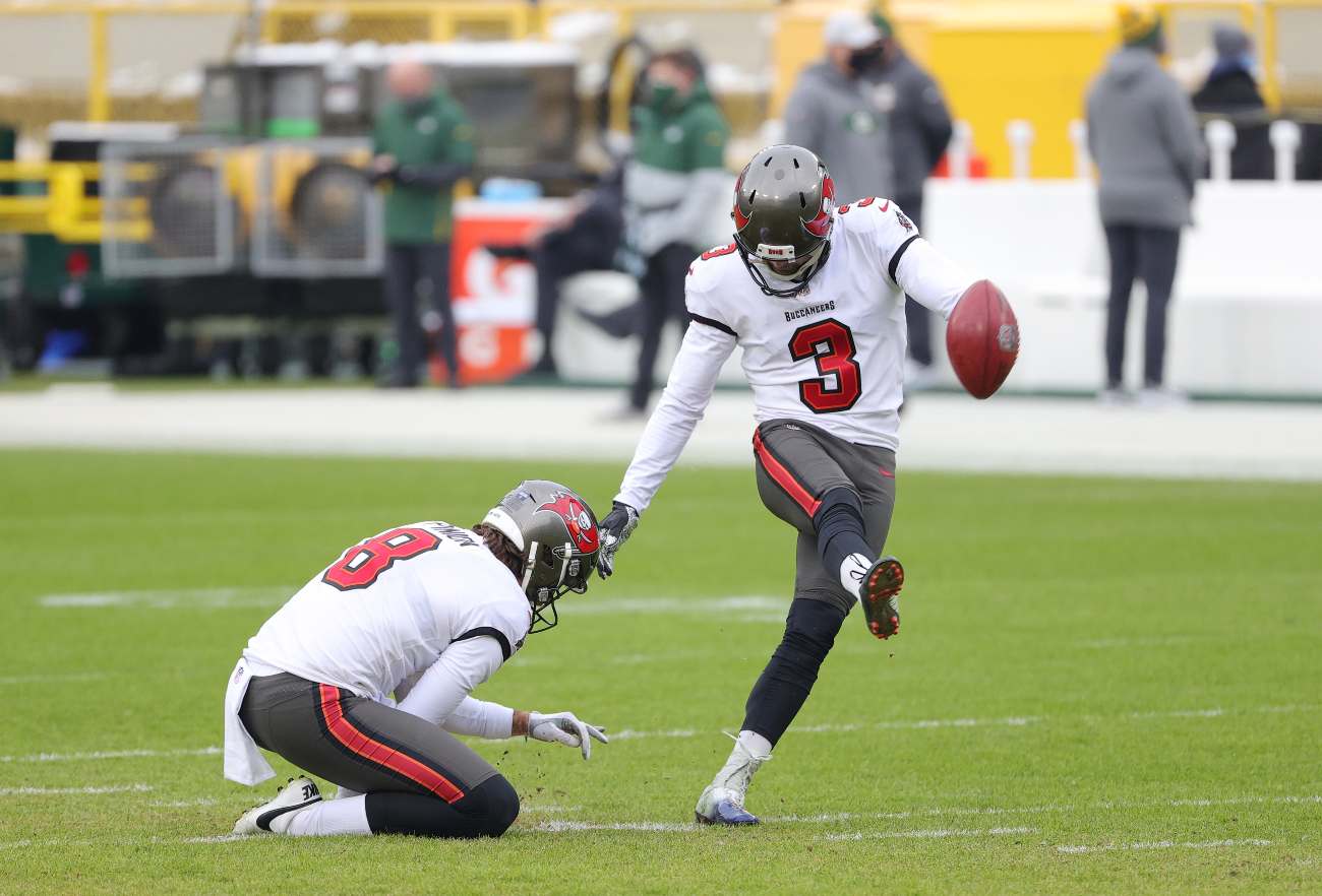 GREEN BAY, WISCONSIN - JANUARY 24: Ryan Succop #3 of the Tampa Bay Buccaneers kicks during warm ups prior to their NFC Championship game against the Green Bay Packers at Lambeau Field on January 24, 2021 in Green Bay, Wisconsin. (Photo by Stacy Revere/Getty Images)