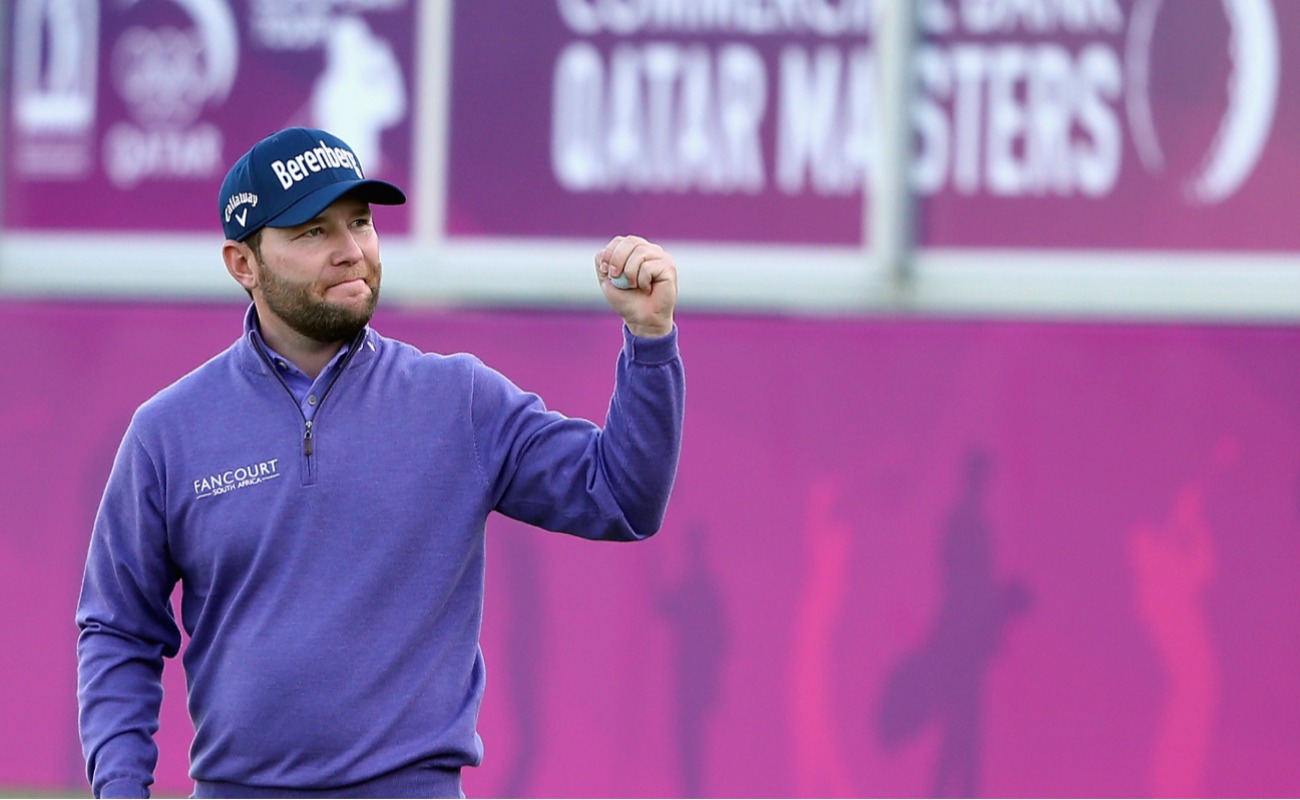 Branden Grace of South Africa celebrates on the 18th green after winning the Commercial Bank Qatar Masters at Doha Golf Club on January 30, 2016 in Doha, Qatar. (Photo by Andrew Redington/Getty Images)