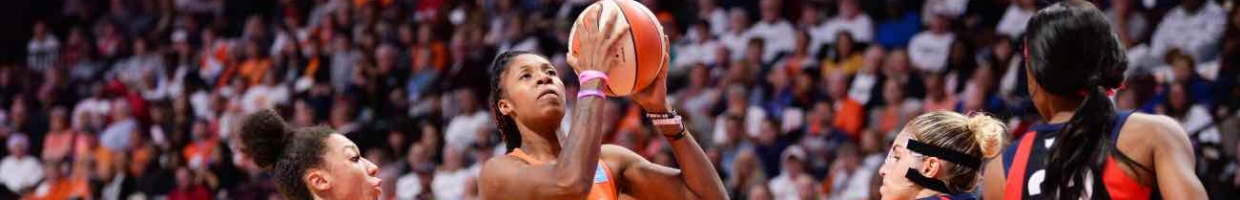 UNCASVILLE, CT - OCTOBER 6: Bria Holmes #32 of the Connecticut Sun drives past Aerial Powers #23 and Elena Delle Donne #11 of the Washington Mystics in the fourth quarter of Game 3 of the WNBA Finals at Mohegan Sun Arena on October 6, 2019 in Uncasville, Connecticut. (Photo by Kathryn Riley/Getty Images)