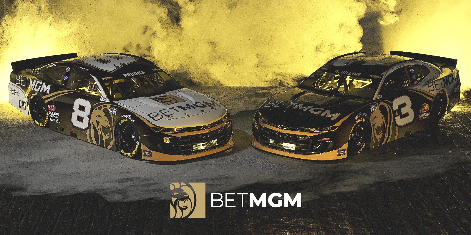 Two NASCAR racecars branded with BetMGM logos with golden lights and smoke in the background and the BetMGM logo on top