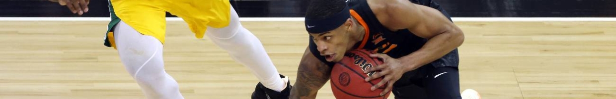 KANSAS CITY, MISSOURI - MARCH 12: Avery Anderson III #0 of the Oklahoma State Cowboys controls the ball as Davion Mitchell #45 of the Baylor Bears defends during the Big 12 basketball tournament semifinal game at the T-Mobile Center on March 12, 2021 in Kansas City, Missouri. (Photo by Jamie Squire/Getty Images)