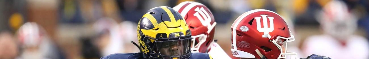 ANN ARBOR, MICHIGAN - NOVEMBER 17: Kwity Paye #19 of the Michigan Wolverines tries to sack Peyton Ramsey #12 of the Indiana Hoosiers at Michigan Stadium on November 17, 2018 in Ann Arbor, Michigan. Michigan won the game 31-20. (Photo by Gregory Shamus/Getty Images)