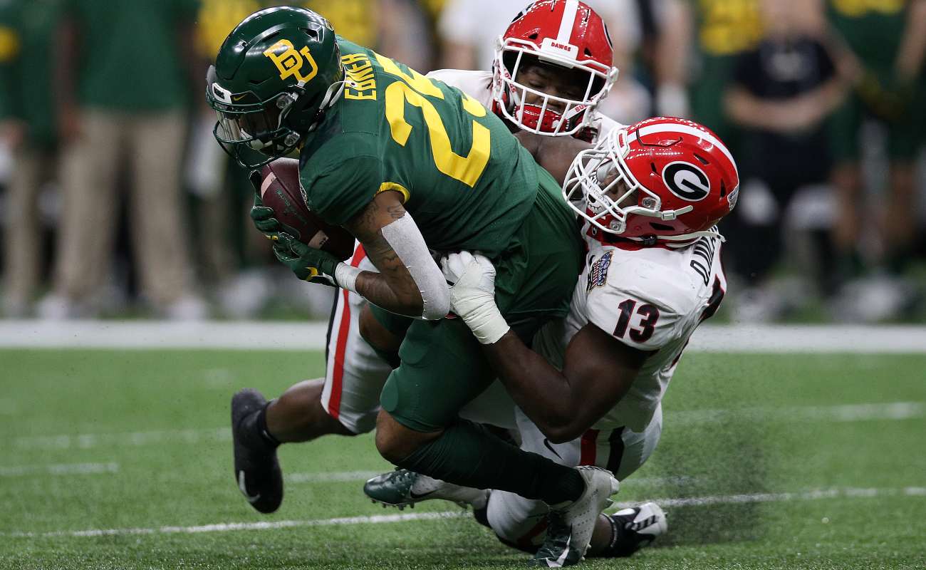 NEW ORLEANS, LOUISIANA - JANUARY 01: Trestan Ebner #25 of the Baylor Bears is tackled by Azeez Ojulari #13 of the Georgia Bulldogs during the Allstate Sugar Bowl at Mercedes Benz Superdome on January 01, 2020 in New Orleans, Louisiana. (Photo by Chris Graythen/Getty Images)
