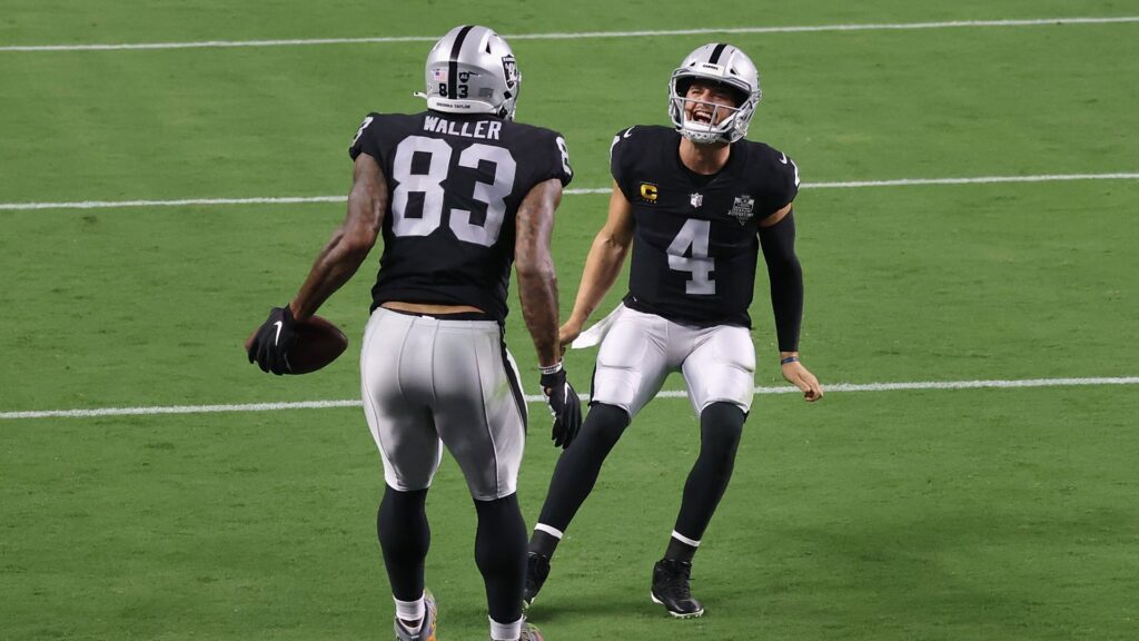 LAS VEGAS, NEVADA - SEPTEMBER 21: Quarterback Derek Carr #4 of the Las Vegas Raiders celebrates with tight end Darren Waller #83 after scoring on a 1-yard touchdown reception during the NFL game at Allegiant Stadium on September 21, 2020 in Las Vegas, Nevada. The Raiders defeated the Saints 34-24. (Photo by Christian Petersen/Getty Images)