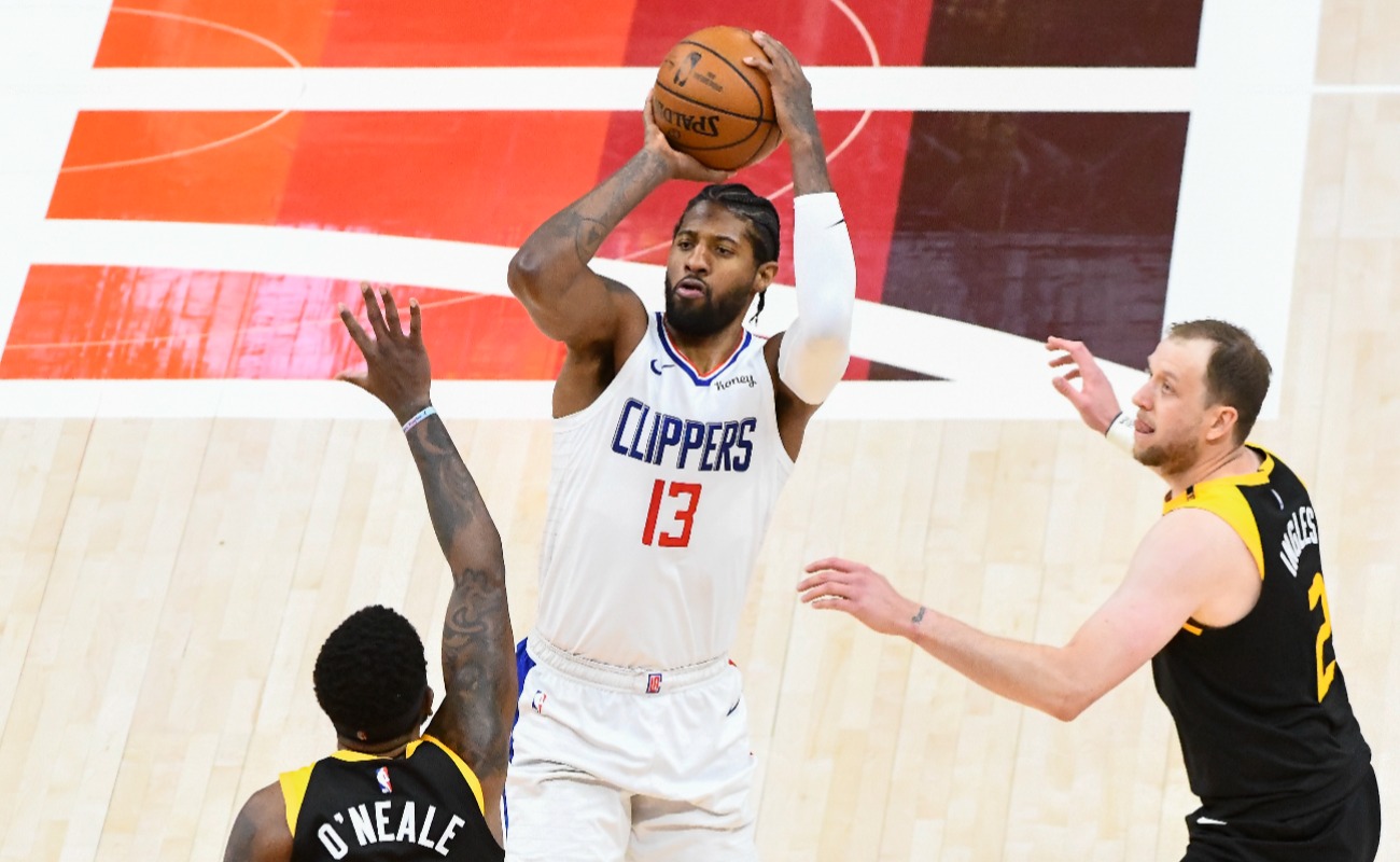 Paul George #13 of the LA Clippers shoots over Royce O'Neale #23 of the Utah Jazz in Game Two of the Western Conference second-round playoff series at Vivint Smart Home Arena on June 10, 2021 in Salt Lake City, Utah. (Photo by Alex Goodlett/Getty Images)