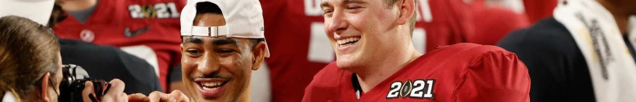 Mac Jones (10) of the Alabama Crimson Tide celebrates defeating the Ohio State Buckeyes 52-24 alongside Bryce Young (#9) in the College Football Playoff National Championship game on Jan. 11, 2021. (Photo by Sam Greenwood/Getty Images)
