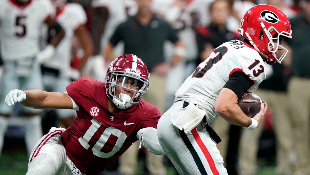 Alabama linebacker Henry To'oTo'o (10) sacks Georgia quarterback Stetson Bennett (13) during the first half of the Southeastern Conference championship NCAA college football game, Saturday, Dec. 4, 2021, in Atlanta. (AP Photo/Brynn Anderson)