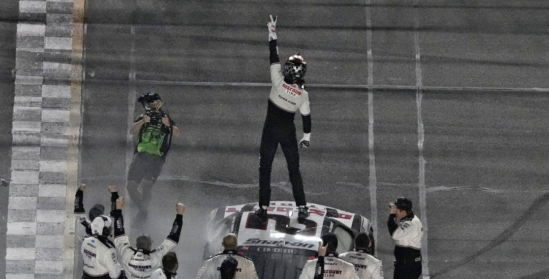 Austin Cindric celebrates on top of his car after winning the NASCAR Daytona 500 auto race Sunday, Feb. 20, 2022, at Daytona International Speedway in Daytona Beach, Fla. (AP Photo/Chris O'Meara)